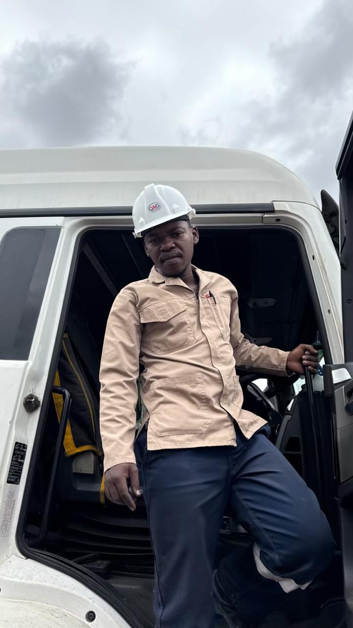 CWG worker in branded CWG hard hat exiting truck cab